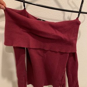 Red, off-the-shoulder sweater